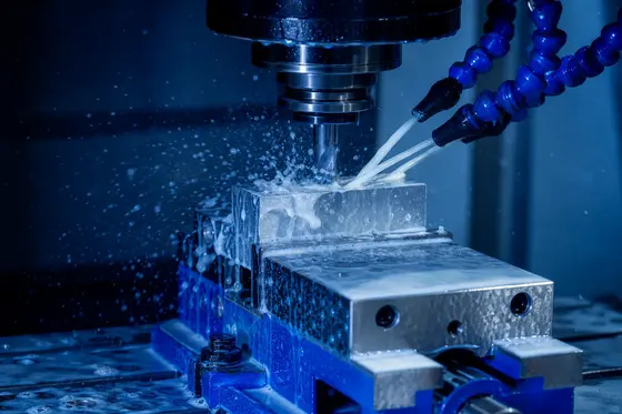 Flood coolant spraying over an end mill cutting aluminum